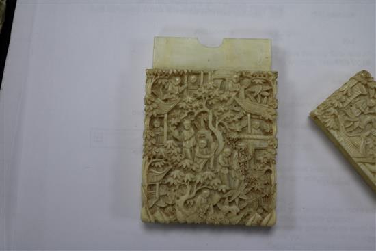 A Chinese ivory carved card case and two parasol handles